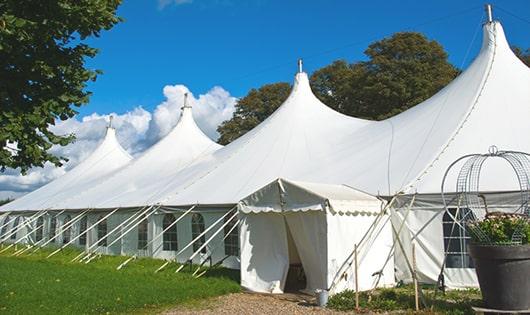 a line of sleek and modern portable restrooms ready for use at an upscale corporate event in East Amherst, NY